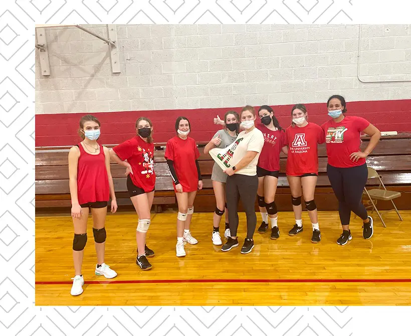 Female volleyball team on court